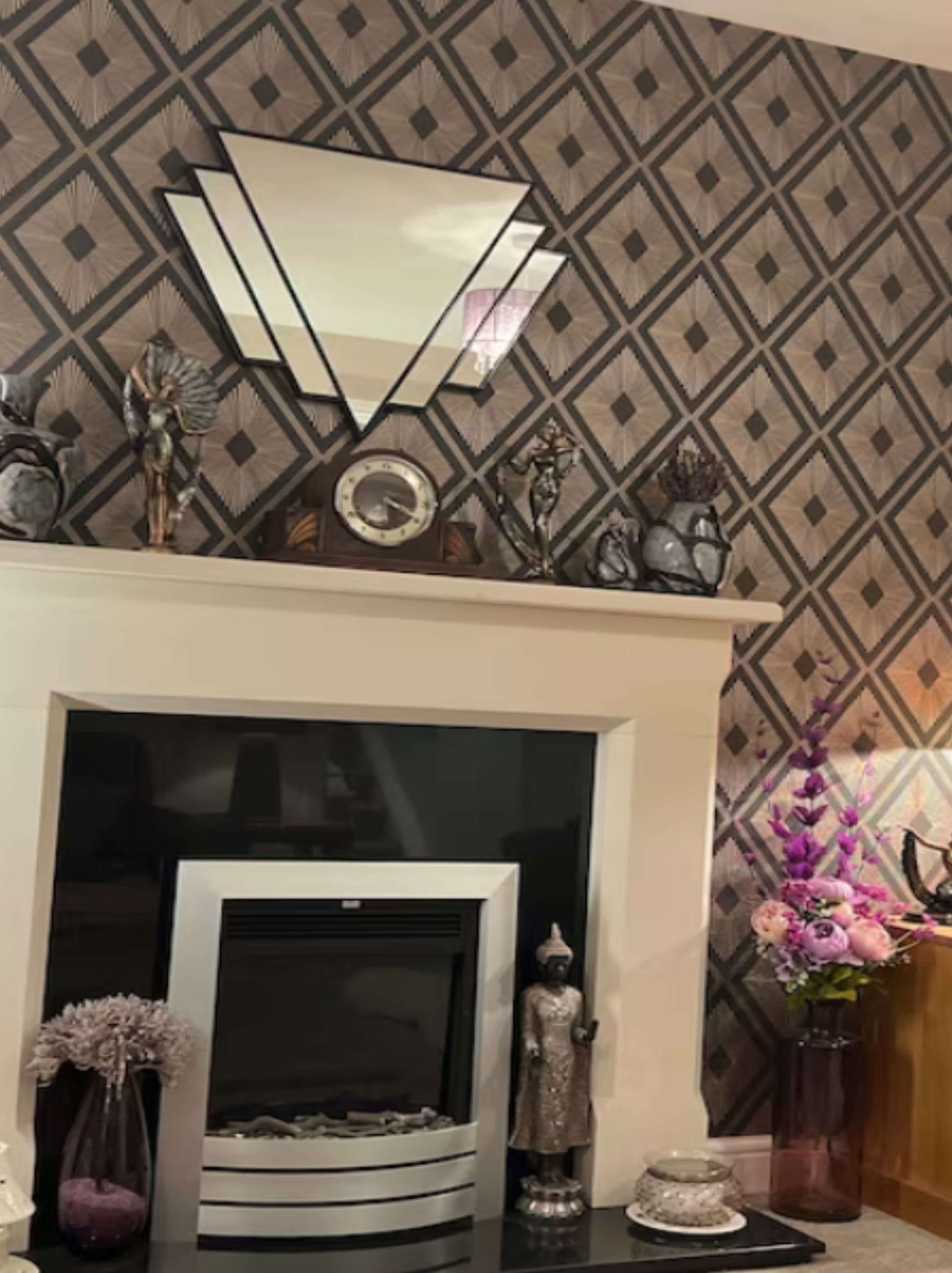 Luxury Rectangle Art Deco Fan Mirror in black lead over mantel with decorative wallpapered wall