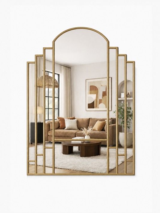 Decorative wall mirror with gold frame in a living room setting