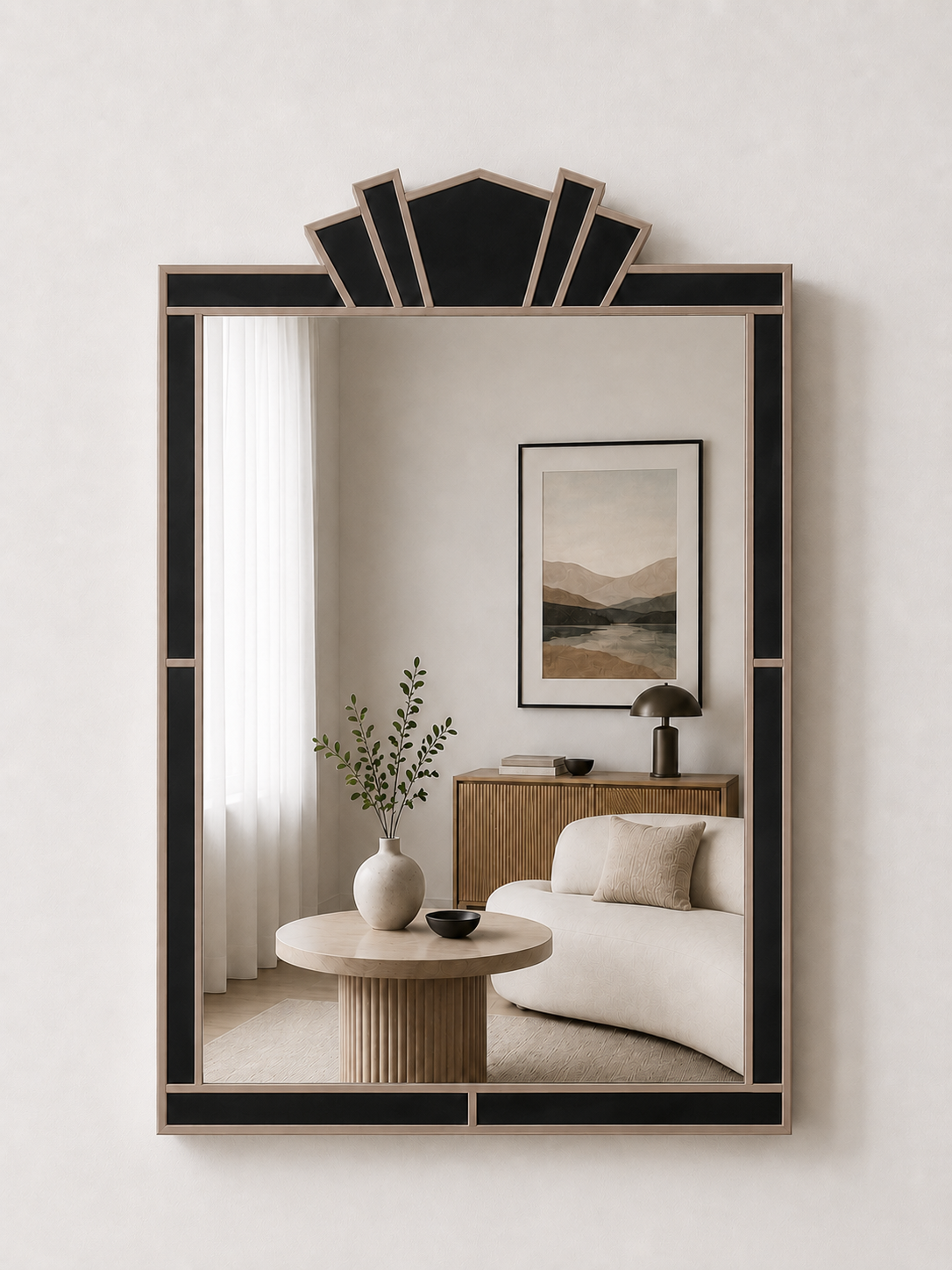 Decorative mirror with a black frame in a room with a sofa and side table.