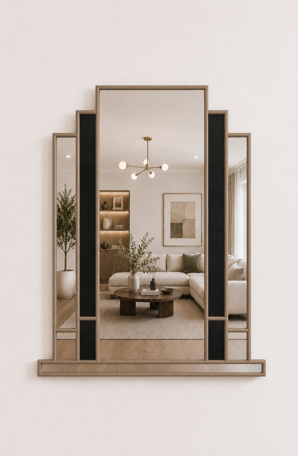 A large rectangular wall mirror with a black metal frame and three vertical inset panels, shown mounted on a light beige wall. The mirror reflects a modern living room interior with a sofa, coffee table, shelving, and pendant light.