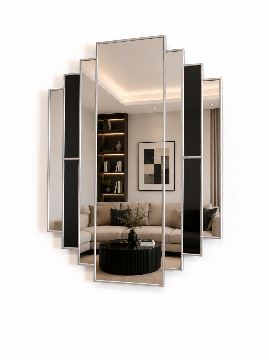 A modern multi-panel wall mirror with a silver frame, shown mounted on a white wall. The mirror is composed of five angled panels, with the center panel reflecting a contemporary living room interior.
